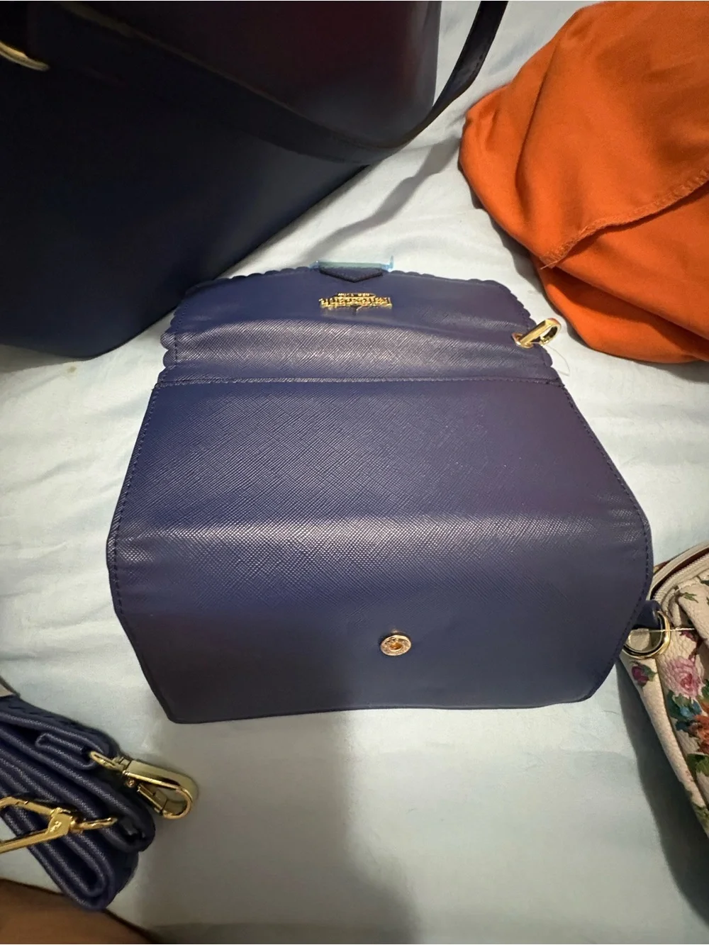 Structured Navy Fashion Tote with Gold Chain Accent and Wallet.